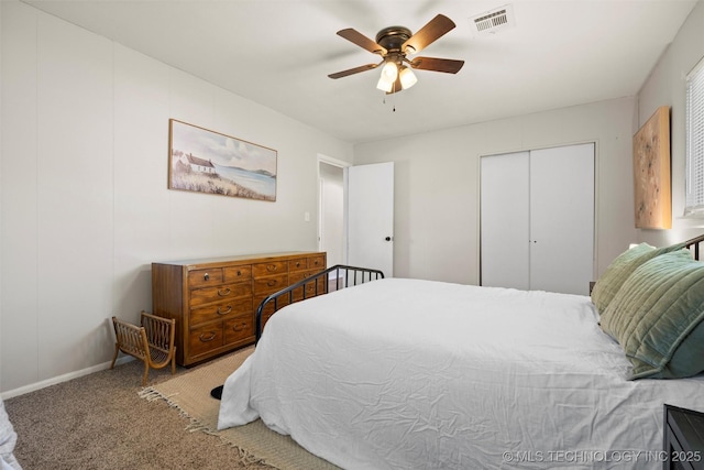 321 NE Elmhurst Ave, Bartlesville, OK 74006 - bedroom with carpet flooring, ceiling fan, and a closet