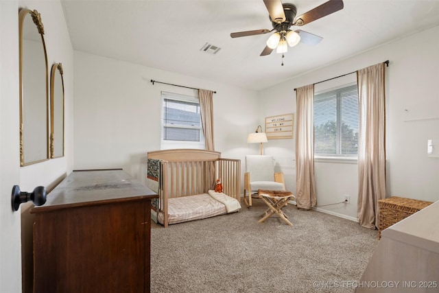321 NE Elmhurst Ave, Bartlesville, OK 74006 - carpeted bedroom with baseboards and a ceiling fan