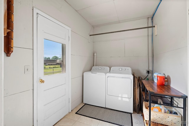 321 NE Elmhurst Ave, Bartlesville, OK 74006 - washroom featuring washer and clothes dryer and light tile patterned flooring