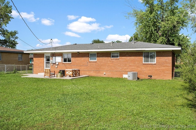 321 NE Elmhurst Ave, Bartlesville, OK 74006 - rear view of house featuring a patio, brick siding, and crawl space