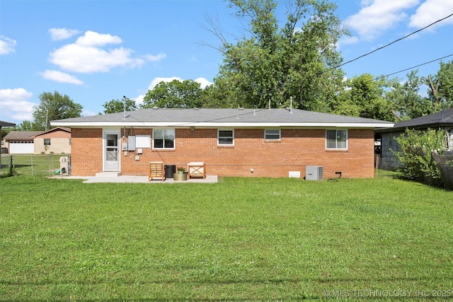 321 NE Elmhurst Ave, Bartlesville, OK 74006 - back of property with a patio, a fenced backyard, brick siding, and crawl space
