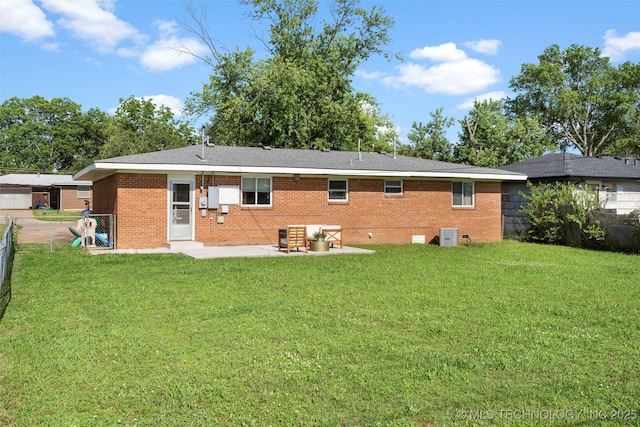 321 NE Elmhurst Ave, Bartlesville, OK 74006 - back of property with a fenced backyard, a patio area, and brick siding