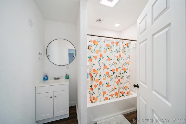 19471 E 335th Rd, Chelsea, OK 74016 - full bathroom with vanity, shower / bath combination with curtain, and wood finished floors