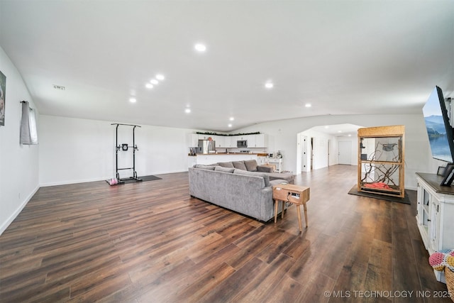 19471 E 335th Rd, Chelsea, OK 74016 - living area with dark wood-style floors, recessed lighting, and arched walkways