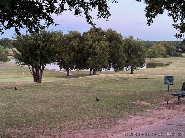 9 Arrowhead, Burneyville, OK 73430 - view of community featuring a yard, a water view, and golf course view