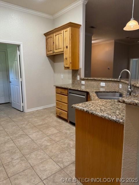 9 Arrowhead, Burneyville, OK 73430 - kitchen featuring stainless steel dishwasher, dark stone countertops, decorative backsplash, ornamental molding, and light tile patterned floors