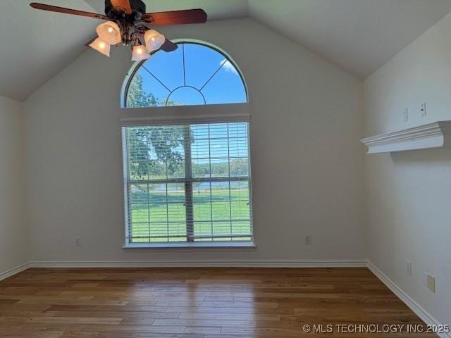 9 Arrowhead, Burneyville, OK 73430 - unfurnished room with healthy amount of natural light, vaulted ceiling, ceiling fan, and wood finished floors