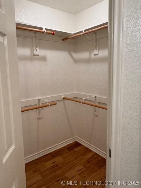9 Arrowhead, Burneyville, OK 73430 - spacious closet featuring wood finished floors