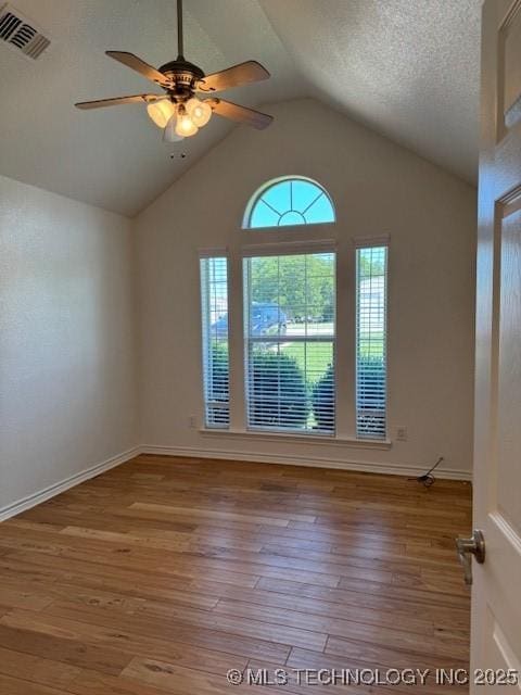 9 Arrowhead, Burneyville, OK 73430 - spare room with ceiling fan, wood finished floors, and lofted ceiling