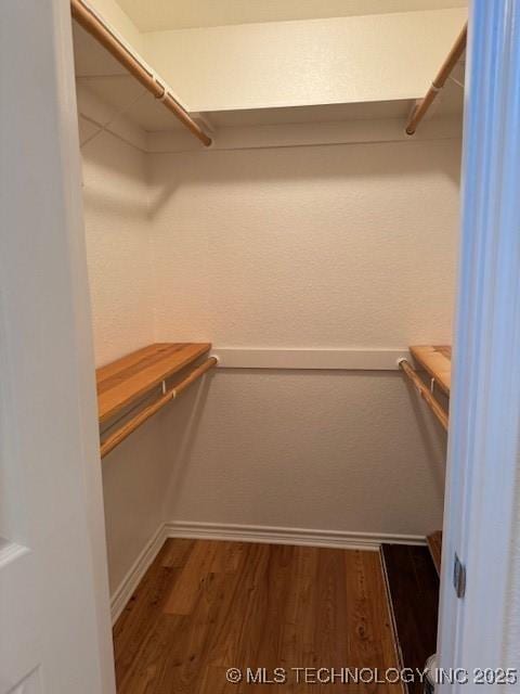 9 Arrowhead, Burneyville, OK 73430 - spacious closet featuring wood finished floors