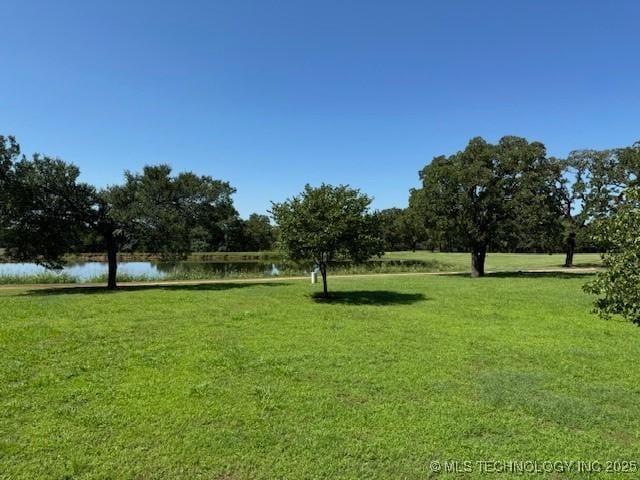9 Arrowhead, Burneyville, OK 73430 - view of community featuring a water view and a yard