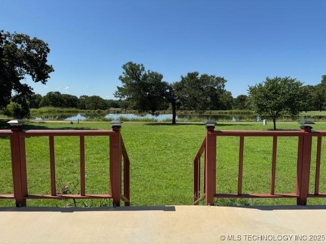 9 Arrowhead, Burneyville, OK 73430 - gate featuring a water view and a yard