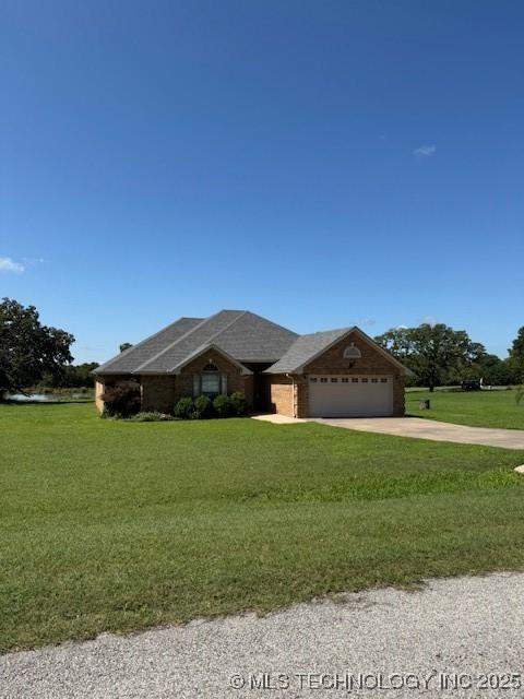 9 Arrowhead, Burneyville, OK 73430 - ranch-style house with a garage, a front yard, and concrete driveway