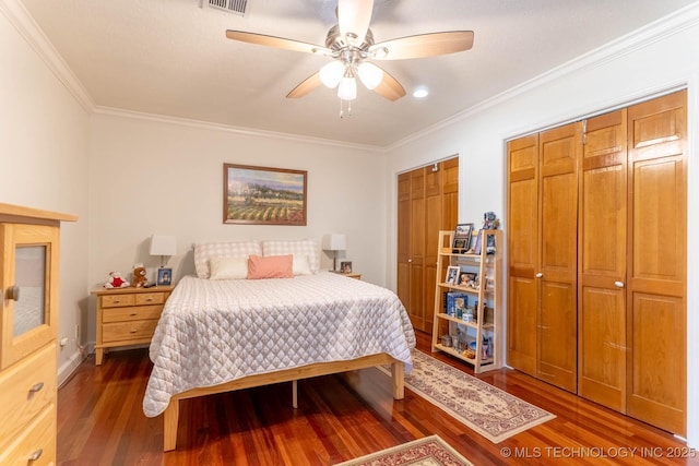 3107 E 84th St, Tulsa, OK 74137 - bedroom with wood finished floors, crown molding, multiple closets, and a ceiling fan