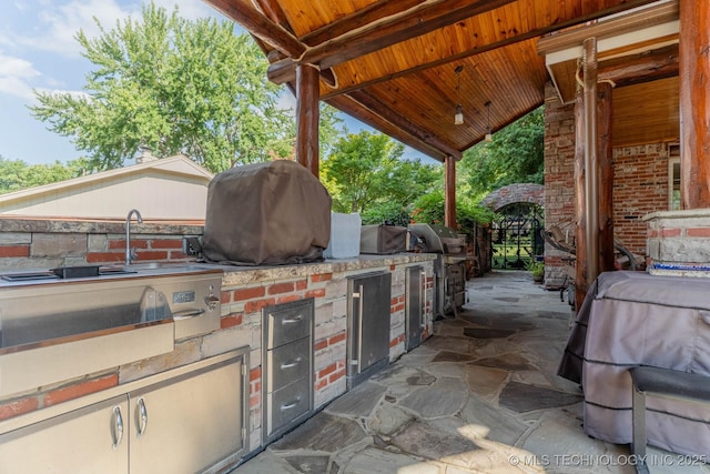 3107 E 84th St, Tulsa, OK 74137 - view of patio featuring an outdoor kitchen