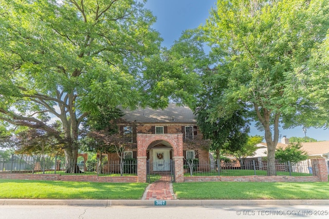 3107 E 84th St, Tulsa, OK 74137 - view of front of home with a fenced front yard and brick siding