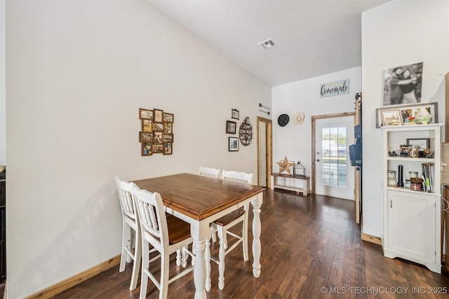 13560 S 4150th Rd, Claremore, OK 74017 - dining room featuring dark wood-style flooring and baseboards