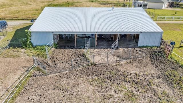 13560 S 4150th Rd, Claremore, OK 74017 - view of front of home with an exterior structure, an outdoor structure, a metal roof, and a rural view