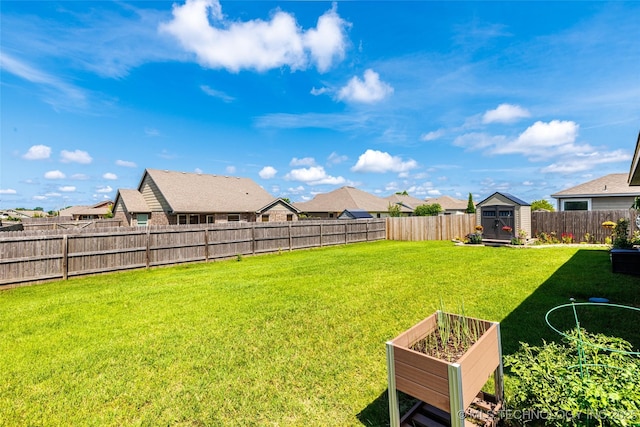 11042 N 120th Ave E, Owasso, OK 74055 - fenced backyard with a storage unit, a residential view, and a garden