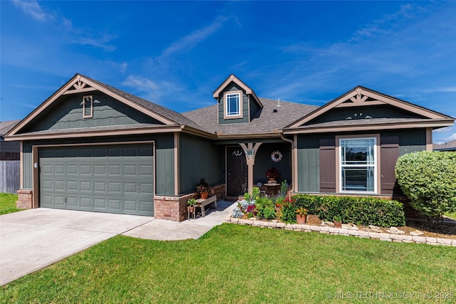 11042 N 120th Ave E, Owasso, OK 74055 - view of front of property featuring a garage, driveway, a front yard, roof with shingles, and brick siding