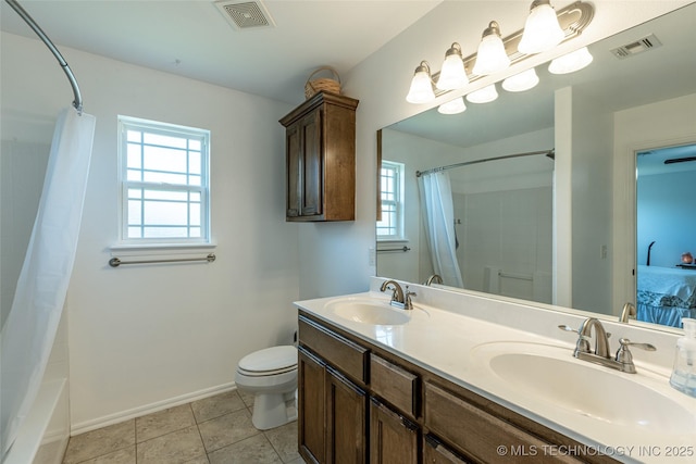 11042 N 120th Ave E, Owasso, OK 74055 - full bathroom with double vanity, shower / bath combination with curtain, and tile patterned flooring