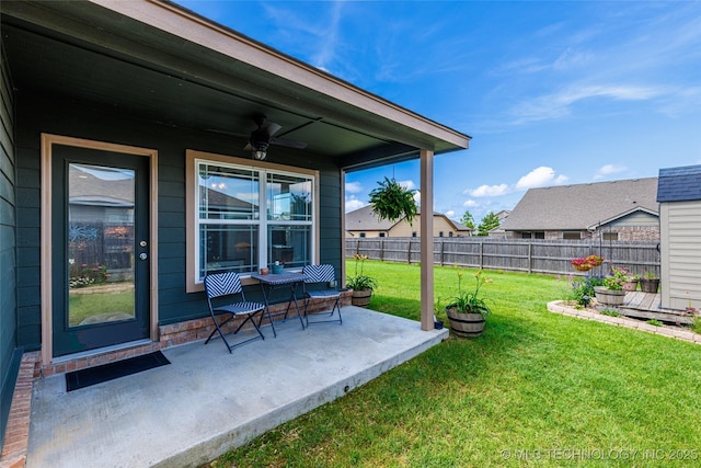 11042 N 120th Ave E, Owasso, OK 74055 - fenced backyard featuring a ceiling fan and a patio