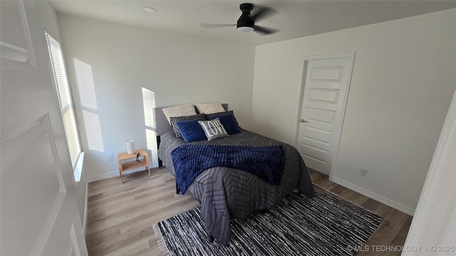 217 E Virgin St, Tulsa, OK 74106 - bedroom featuring multiple windows, light wood finished floors, and a ceiling fan