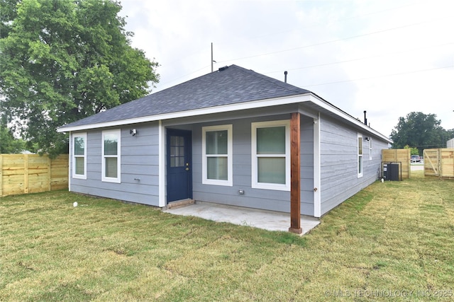 217 E Virgin St, Tulsa, OK 74106 - rear view of house featuring a shingled roof and a patio area