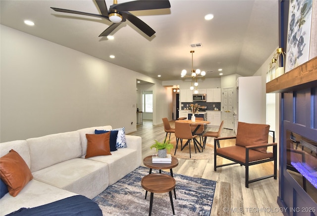 217 E Virgin St, Tulsa, OK 74106 - living area featuring light wood finished floors, recessed lighting, a chandelier, a ceiling fan, and lofted ceiling