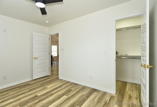 217 E Virgin St, Tulsa, OK 74106 - unfurnished bedroom featuring wood finished floors, a closet, and ceiling fan