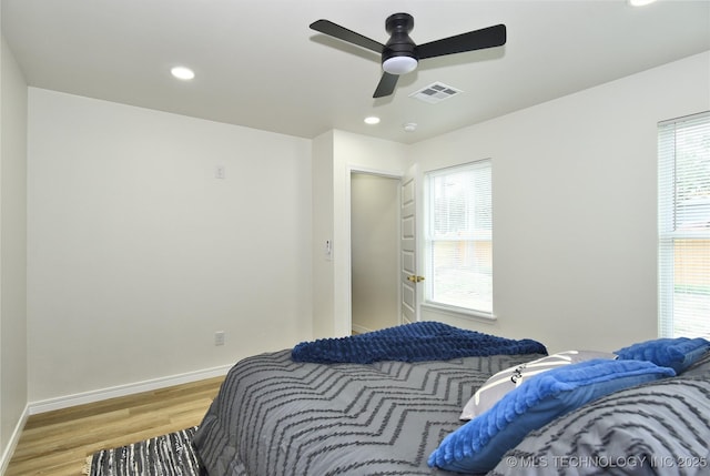 217 E Virgin St, Tulsa, OK 74106 - bedroom with light wood-type flooring, recessed lighting, and a ceiling fan
