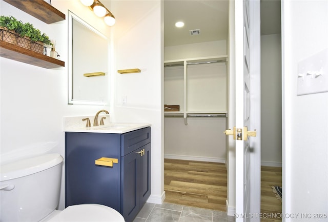 217 E Virgin St, Tulsa, OK 74106 - bathroom with vanity and a spacious closet