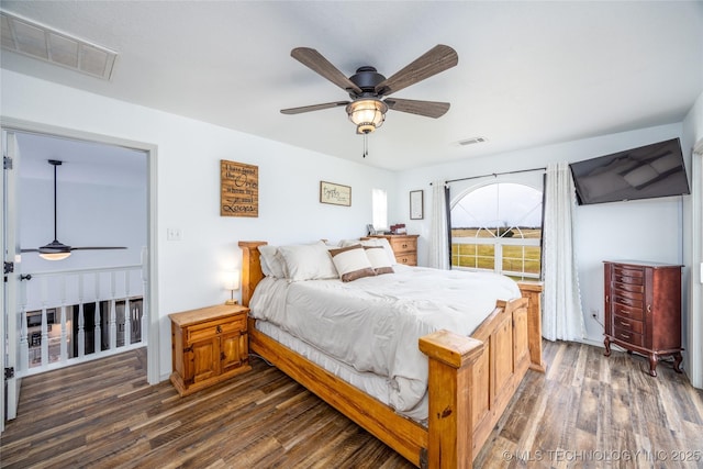 1522 Burney Cemetary, Calera, OK 74730 - bedroom featuring dark wood-style floors and a ceiling fan