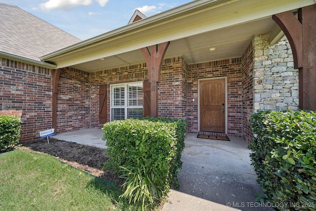 8483 N 68th E Ave, Owasso, OK 74055 - doorway to property featuring brick siding