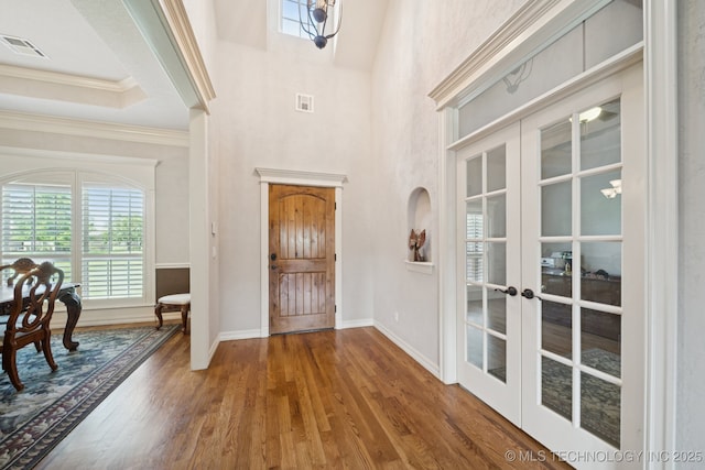 8483 N 68th E Ave, Owasso, OK 74055 - entrance foyer featuring french doors, wood finished floors, and crown molding