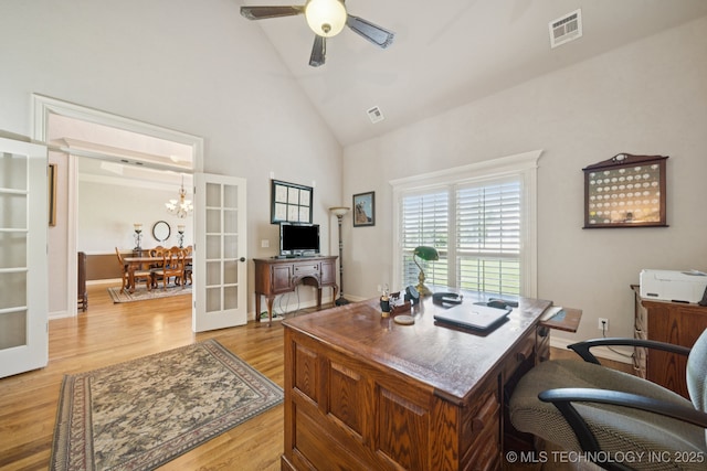 8483 N 68th E Ave, Owasso, OK 74055 - office area with light wood finished floors, high vaulted ceiling, a ceiling fan, french doors, and a chandelier