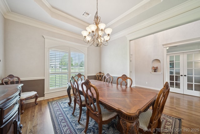 8483 N 68th E Ave, Owasso, OK 74055 - dining area featuring a chandelier, french doors, wood finished floors, ornamental molding, and a tray ceiling