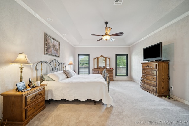 8483 N 68th E Ave, Owasso, OK 74055 - bedroom with carpet, a raised ceiling, a ceiling fan, and ornamental molding