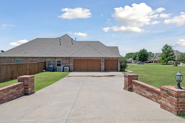 8483 N 68th E Ave, Owasso, OK 74055 - view of home's exterior featuring driveway, an attached garage, a shingled roof, and brick siding