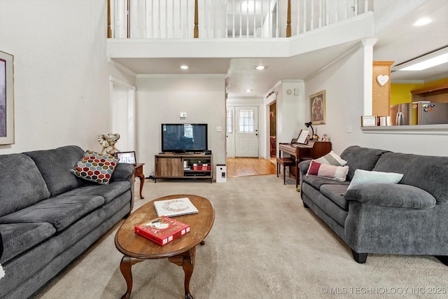 1720 S Juniper Ave, Broken Arrow, OK 74012 - carpeted living room featuring a towering ceiling, crown molding, and recessed lighting