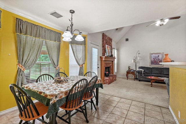 1720 S Juniper Ave, Broken Arrow, OK 74012 - dining area featuring light carpet, light tile patterned flooring, a fireplace, vaulted ceiling, and a ceiling fan