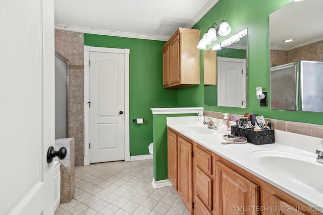 1720 S Juniper Ave, Broken Arrow, OK 74012 - bathroom with a shower stall, double vanity, tile patterned flooring, and crown molding