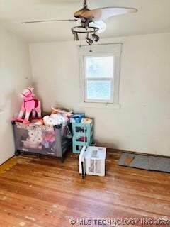 213 W Pine St, Coweta, OK 74429 - bedroom with wood finished floors