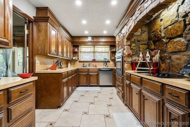 2528 W Commercial St, Broken Arrow, OK 74012 - kitchen with stainless steel appliances, open shelves, recessed lighting, a textured ceiling, and light countertops