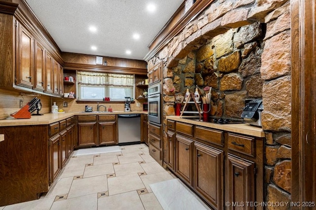 2528 W Commercial St, Broken Arrow, OK 74012 - kitchen with stainless steel appliances, open shelves, recessed lighting, a textured ceiling, and light countertops
