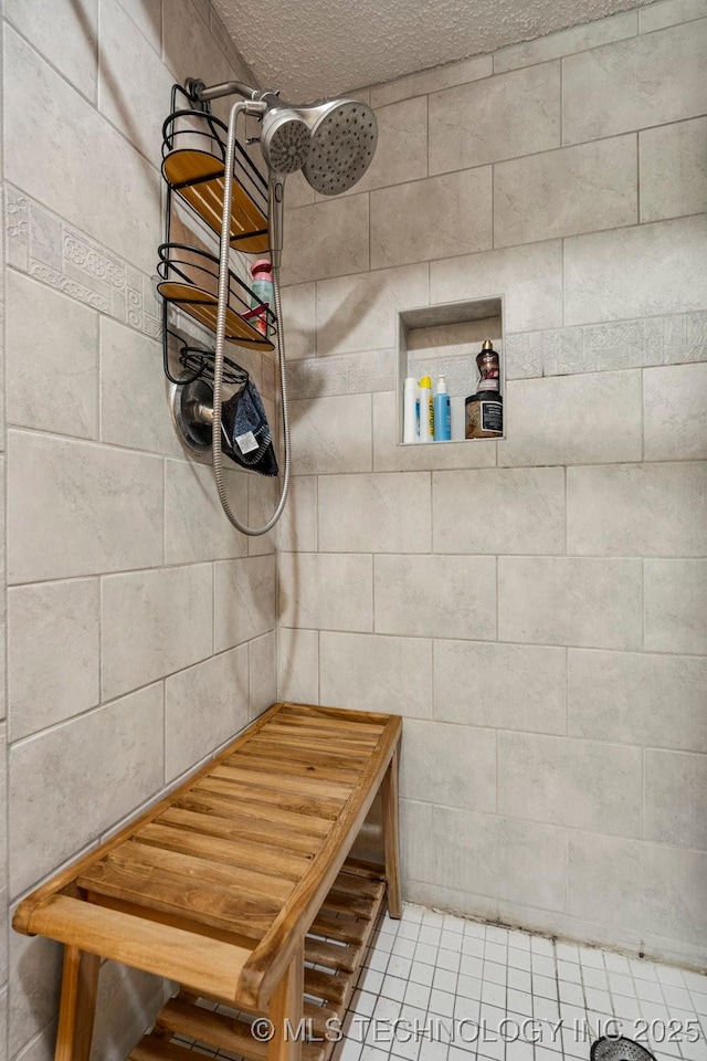 2528 W Commercial St, Broken Arrow, OK 74012 - bathroom featuring tiled shower and a textured ceiling