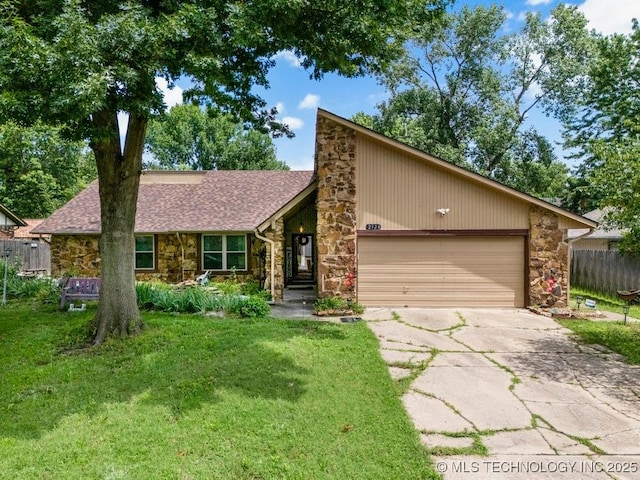 2528 W Commercial St, Broken Arrow, OK 74012 - mid-century home with stone siding, a garage, concrete driveway, and a shingled roof