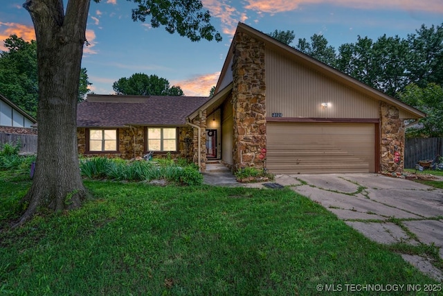 2528 W Commercial St, Broken Arrow, OK 74012 - mid-century modern home with stone siding, driveway, and a garage