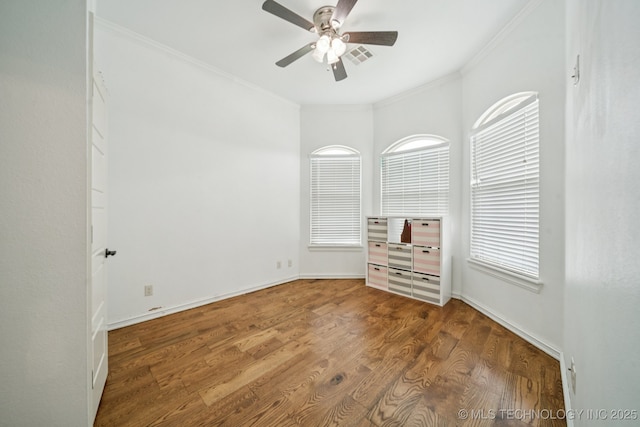 905 W Elmira St, Broken Arrow, OK 74012 - unfurnished room featuring crown molding, ceiling fan, wood finished floors, and plenty of natural light