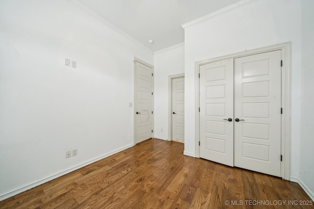 905 W Elmira St, Broken Arrow, OK 74012 - unfurnished bedroom featuring ornamental molding, wood finished floors, and a closet